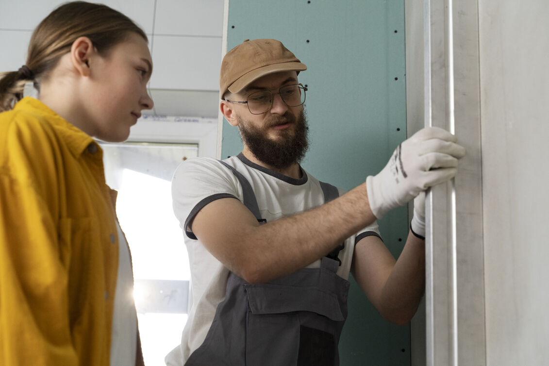 Professional drywall repair team at work