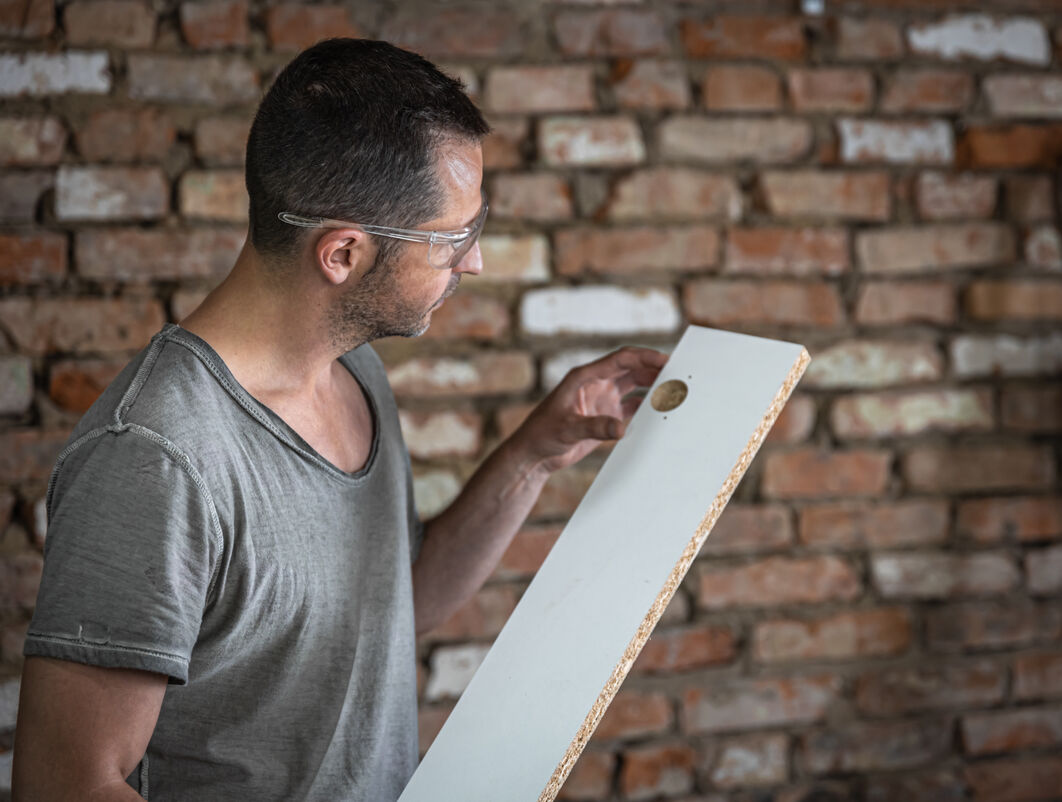 Professional drywall repair expert at work